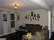 Comfortable living room featuring a sofa, dark floors, and natural light at 981 E Atlanta Rd, Stockbridge, GA 30281