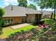 Spacious backyard featuring a brick patio, fire pit, and lush green lawn at 211 English Oaks Ln, Mcdonough, GA 30253