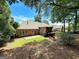 Well-maintained backyard with a brick patio and fire pit area for outdoor enjoyment at 211 English Oaks Ln, Mcdonough, GA 30253