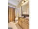 Well-lit bathroom featuring a shower-tub combo, toilet, and vanity at 211 English Oaks Ln, Mcdonough, GA 30253