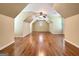 Spacious bonus room with hardwood floors, a ceiling fan, and natural light at 211 English Oaks Ln, Mcdonough, GA 30253
