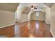 Large bonus room with hardwood floors, ceiling fan, and natural light at 211 English Oaks Ln, Mcdonough, GA 30253