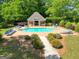 Community pool with lounge chairs and covered patio, perfect for relaxing and socializing at 211 English Oaks Ln, Mcdonough, GA 30253