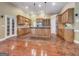 Open kitchen with wooden cabinets, granite countertops, stainless steel appliances, tile backsplash and tile floors at 211 English Oaks Ln, Mcdonough, GA 30253