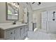 Bathroom featuring gray vanity, white countertop, and marble-style floors at 604 Magnolia Ln, Peachtree City, GA 30269