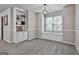 Bonus room with built-in shelves, carpeted floor, and abundant natural light at 604 Magnolia Ln, Peachtree City, GA 30269