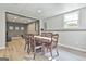 Cozy dining area with wood floors, a decorative ceiling, and a round dining table with seating for six at 604 Magnolia Ln, Peachtree City, GA 30269
