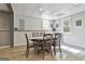 Charming dining area features wood floors, decorative ceiling, and round table with cross-back chairs for six at 604 Magnolia Ln, Peachtree City, GA 30269