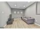 Cozy living room with gray walls, wood floors, and a comfortable sofa at 604 Magnolia Ln, Peachtree City, GA 30269