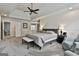 Neutral-toned main bedroom with a vaulted ceiling, ceiling fan, and carpeted floor at 604 Magnolia Ln, Peachtree City, GA 30269