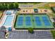 An aerial view of tennis courts, a pool, playground and parking, highlighting recreational amenities for residents at 6317 Benbrooke Nw Overlook, Acworth, GA 30101