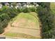 A large, fenced recreational field surrounded by trees, offering privacy and space for outdoor activities at 6317 Benbrooke Nw Overlook, Acworth, GA 30101