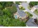 Aerial view of the property showcasing the backyard pool, patio area, landscaping, and surrounding neighborhood at 6317 Benbrooke Nw Overlook, Acworth, GA 30101