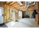 Unfinished basement space with exposed framing and natural light from windows at 6317 Benbrooke Nw Overlook, Acworth, GA 30101