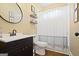 Cozy bathroom with modern fixtures, a vanity with storage, and a shower with a shower curtain at 6317 Benbrooke Nw Overlook, Acworth, GA 30101