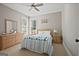 Comfortable bedroom with natural light, a ceiling fan, and neutral decor, creating a relaxing atmosphere at 6317 Benbrooke Nw Overlook, Acworth, GA 30101