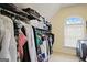 Bright walk-in closet with ample storage and a window that provides natural light at 6317 Benbrooke Nw Overlook, Acworth, GA 30101