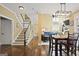 Inviting entryway with hardwood floors, staircase, and a view into the dining and living spaces at 6317 Benbrooke Nw Overlook, Acworth, GA 30101