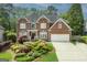 Charming two-story brick home with well-maintained landscaping and a two-car garage at 6317 Benbrooke Nw Overlook, Acworth, GA 30101