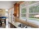 Bright kitchen with stainless steel sink, granite countertops, and a view of the backyard swimming pool at 6317 Benbrooke Nw Overlook, Acworth, GA 30101