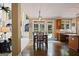 Dining room with hardwood floors and a view of the kitchen and outdoor pool at 6317 Benbrooke Nw Overlook, Acworth, GA 30101