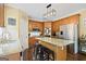 Charming kitchen featuring granite countertops, stainless steel appliances, and a cozy breakfast bar at 6317 Benbrooke Nw Overlook, Acworth, GA 30101