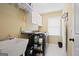 Well-organized laundry room with white cabinets and functional workspace at 6317 Benbrooke Nw Overlook, Acworth, GA 30101
