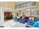 Open-concept living room with staircase and view to the kitchen and breakfast nook at 6317 Benbrooke Nw Overlook, Acworth, GA 30101