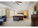 Spacious main bedroom with large windows, a tray ceiling, and comfortable furnishings at 6317 Benbrooke Nw Overlook, Acworth, GA 30101