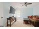 Sitting room featuring a comfortable couch, tv and window at 6317 Benbrooke Nw Overlook, Acworth, GA 30101