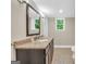 Bathroom with a granite sink and natural light at 200 Camp Creek Trail, Peachtree City, GA 30269