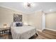 Bedroom featuring neutral walls, a ceiling fan, and hardwood floors at 200 Camp Creek Trail, Peachtree City, GA 30269