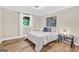 Bedroom with a blue and white color scheme and hardwood floors at 200 Camp Creek Trail, Peachtree City, GA 30269
