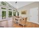 Bright dining area with hardwood floors, backyard views, and an elegant dining table with seating for six at 200 Camp Creek Trail, Peachtree City, GA 30269