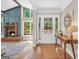 Inviting entryway with hardwood floors and a view of the front yard through a glass door at 200 Camp Creek Trail, Peachtree City, GA 30269