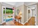 Welcoming entryway with a red door and a wooden console table at 200 Camp Creek Trail, Peachtree City, GA 30269