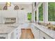 Bright kitchen with granite countertops, stainless steel appliances, and an abundance of natural light at 200 Camp Creek Trail, Peachtree City, GA 30269