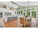 Bright kitchen and eat-in kitchen with hardwood floors, a large island, breakfast bar, and beautiful windows with backyard views at 200 Camp Creek Trail, Peachtree City, GA 30269