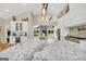 Open kitchen featuring an island with bar seating and a modern range, with views into the living room at 200 Camp Creek Trail, Peachtree City, GA 30269