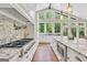 Gourmet kitchen with granite countertops, stainless steel range, and large island with seating at 200 Camp Creek Trail, Peachtree City, GA 30269