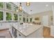 Bright kitchen with stainless steel appliances, granite countertops, and an island with bar seating at 200 Camp Creek Trail, Peachtree City, GA 30269