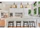 Large kitchen island with granite countertops, pendant lighting, and room for seating at 200 Camp Creek Trail, Peachtree City, GA 30269
