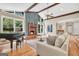 Bright living room with a fireplace, high ceilings, and a comfortable sofa at 200 Camp Creek Trail, Peachtree City, GA 30269