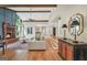 Spacious living room featuring a fireplace, beamed ceilings, and hardwood floors at 200 Camp Creek Trail, Peachtree City, GA 30269