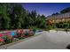 Backyard pool and seating area with roses and outdoor lighting at 200 Camp Creek Trail, Peachtree City, GA 30269