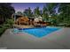 Inviting backyard pool with a charming pergola and beautiful landscaping at 200 Camp Creek Trail, Peachtree City, GA 30269
