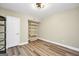 Tan painted room with hardwood floors and a white door at 200 Camp Creek Trail, Peachtree City, GA 30269