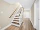 Basement stairs with wooden treads, white risers, and a hardwood floor at 200 Camp Creek Trail, Peachtree City, GA 30269