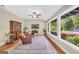 Sunroom featuring large windows and comfortable seating at 200 Camp Creek Trail, Peachtree City, GA 30269