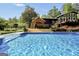 Inviting swimming pool with nearby cabana, offering a luxurious outdoor experience for relaxation and recreation at 200 Camp Creek Trail, Peachtree City, GA 30269